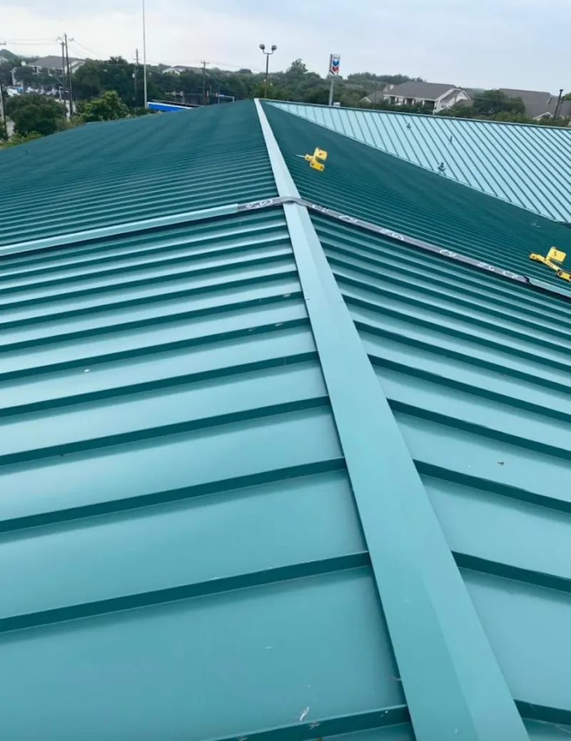Green commercial metal roof ridge and valley for Metal Roof Repair in Bozeman